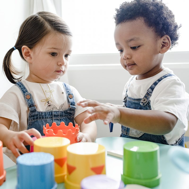 Little kids playing toys at learning center